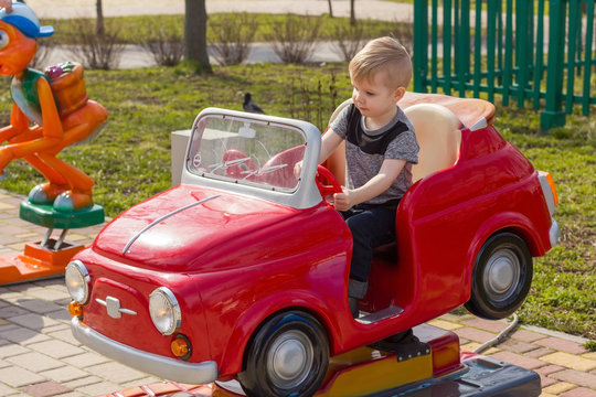 Little boy is riding the car