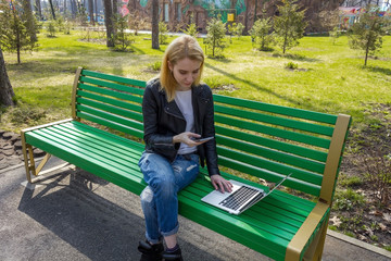 Woman with laptop and telephone