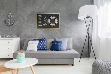 Modern grey interior with nautical decorations and trendy wall finish