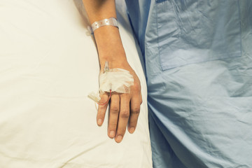 abstract hand of patient on the bed for recovery from six
