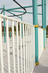 Thw white metal fense with blue metal bulks