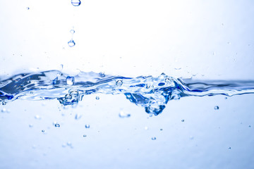 Closeup water wave and air bubbles in water.