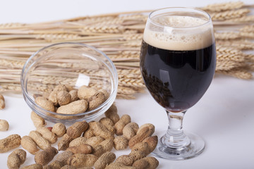 Black beer in the glass on the table
