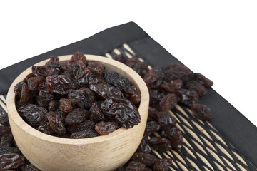 raisins in bowl isolated on white background