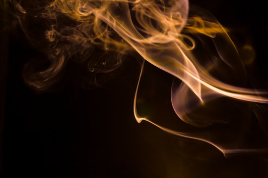 Gold Smoke Movement On Black Background.