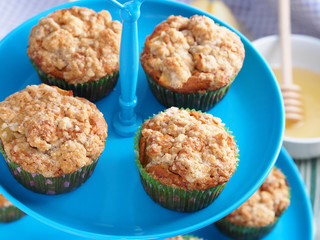 Spiced apple muffins on blue stand