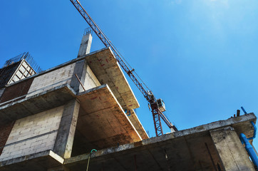 Fototapeta na wymiar Construction site with cranes on blue sky background