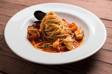 Seafood spaghetti on white plate