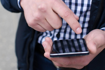 Young man using his phone