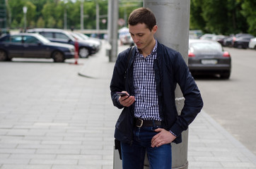 Young man using his phone