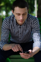 Young man using his phone