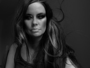 Black and white Portrait of young woman looking at camera