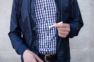 Young man smoking cigarette 