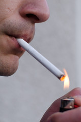 Young man smoking cigarette 