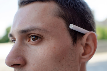 Young man smoking cigarette 