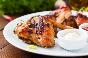 Baked chicken wings in the Asian style on plate.