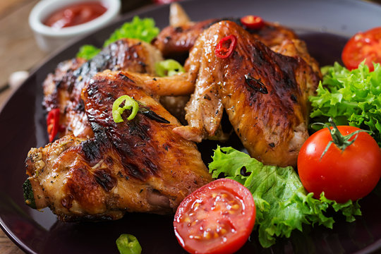 Baked Chicken Wings In The Asian Style On Plate.