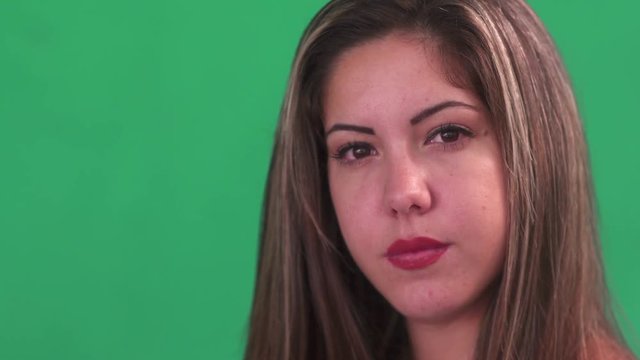Portrait of sad people with emotions and feelings. Sadness, depression, anxiety. Worried hispanic young woman looking at camera with depressed expression on face. Close up, copy space