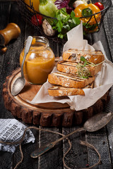 Squash appetizer with bread on a wooden board.