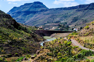 Naklejka premium Valley with dam and a water reservoir