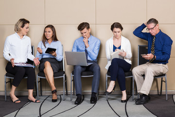 Five Applicants for Corporate Job Sitting in Line