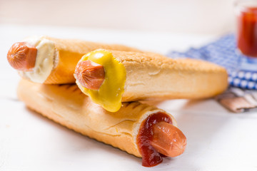 European hot dogs with different sauces