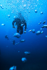 Scuba Diver Silhouette and Air Bubbles