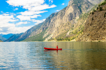 Majestic mountain lake in Canada. Seton Lake in British Columbia, Canada. Red canoe.