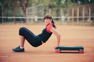 A young woman engaged in fitness outdoors