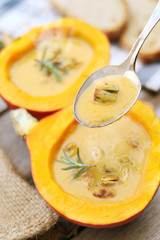 Fresh homemade pumpkin soup served in the pumpkin shell