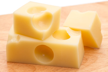 Three slices of Swiss cheese