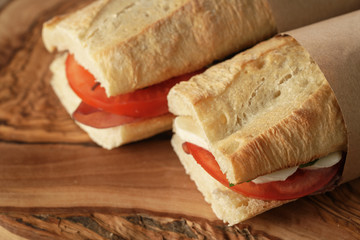 two homemade italian sandwiches with bresaola and mozzarella