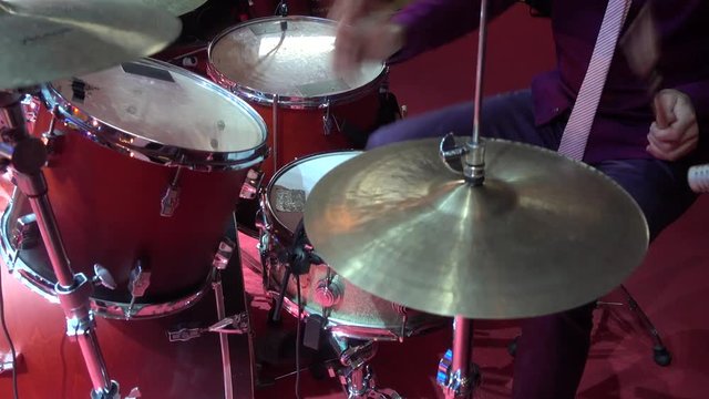 Man playing the drums on stage