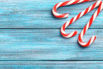 Christmas candy can on a blue wooden table