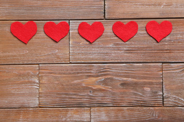 Love hearts on a brown wooden table