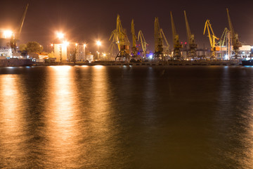 Fototapeta na wymiar Cargo loading / discharging terminal of port Odessa, Ukraine. Night view picture