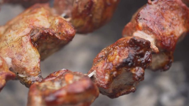 Meat on grill. Cooking shish kebab on skewers.