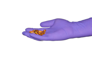 Medical pills in hand.