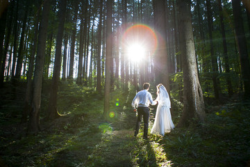 Bride and groom by the sea on their wedding day.
wedding begining of new life.
wedding on the...