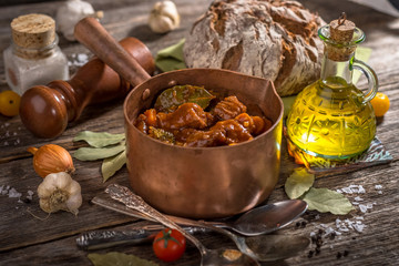 Homemade Goulash on wooden background