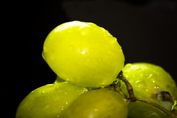 Bunch of grapes on a black slate stone