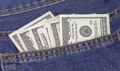 Dollars in jeans pocket