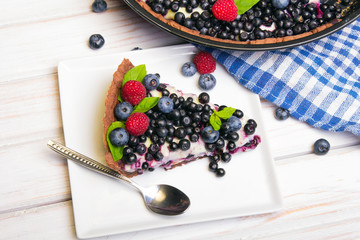 Delicious tart with blueberries and raspberries