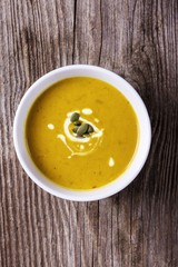 Pumpkin soup on a wooden table