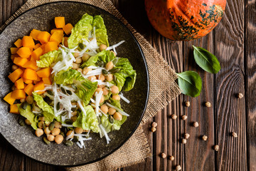 Pumpkin salad with chickpeas, radish, lettuce and seeds