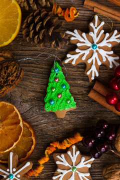christmas gingerbread green tree cookie with spices and decorations close up