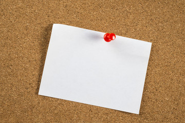 Thumbtack and note on corkboard