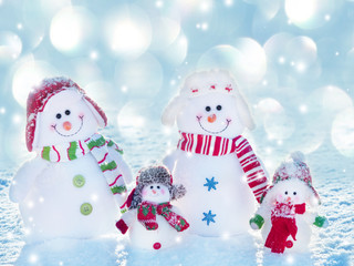 Family snowman on snow