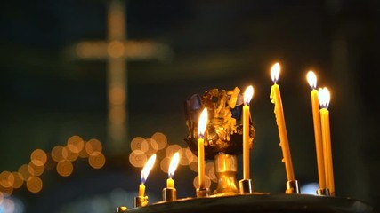 Candles Burning in the Orthodox Cathedral. the Wax Melts and Flows Down on the Bottom of the Candle