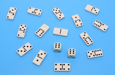 domino and game dice background on blue abstract